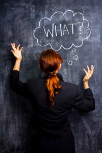 21561799 - redhead businesswoman at blackboard asking what